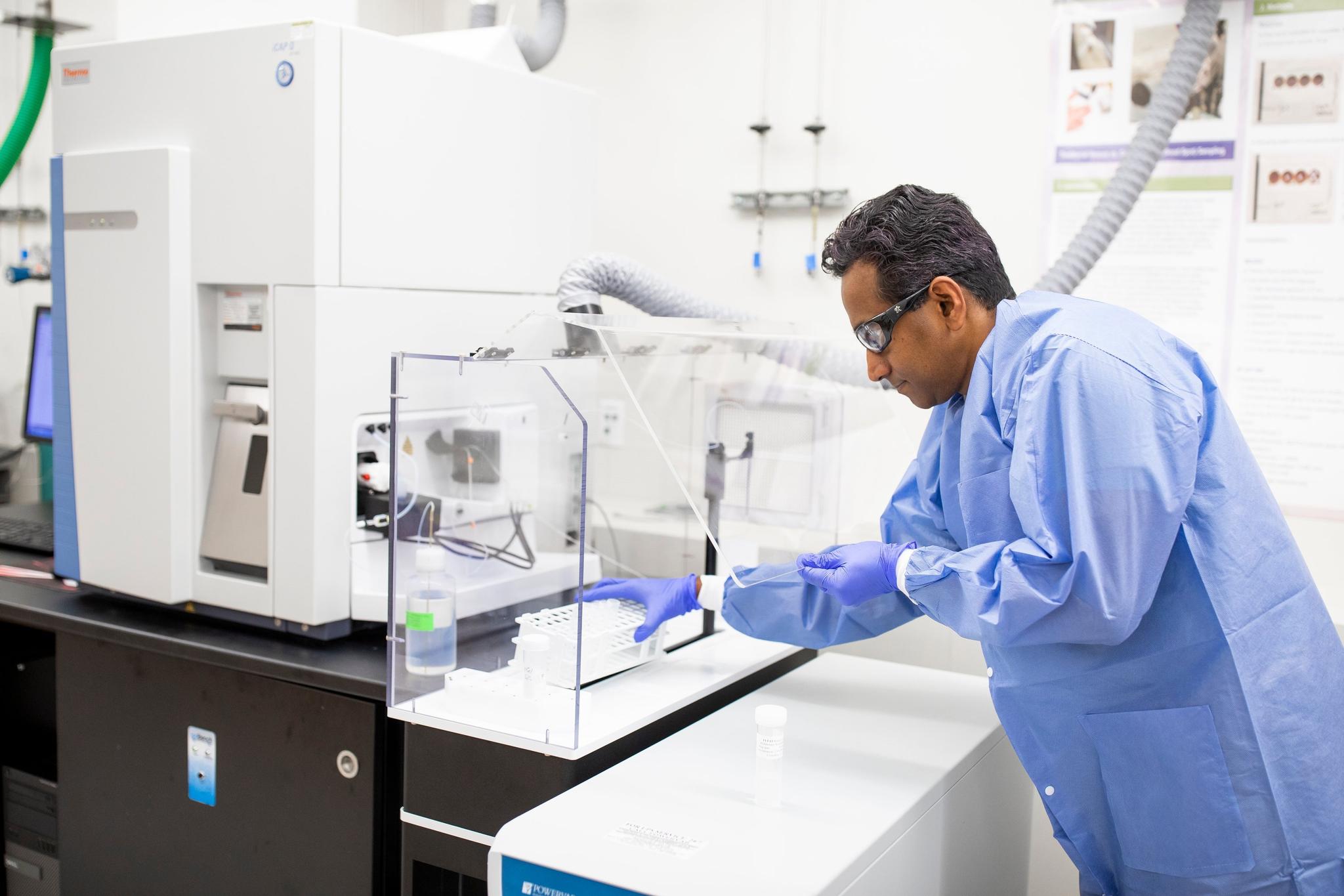 Researchers reviewing data on a computer