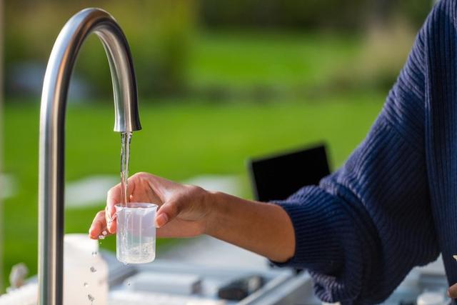 Collecting a water sample from a tap